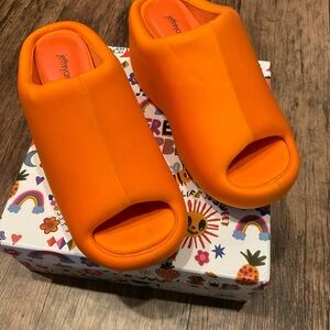 Jeffrey Campbell women’s Bright Orange Slip-On Mules